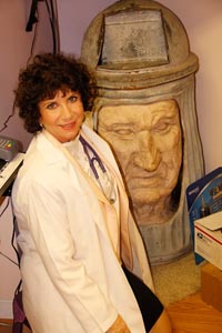 Dr. Swerdloff and her artwork: trash can man